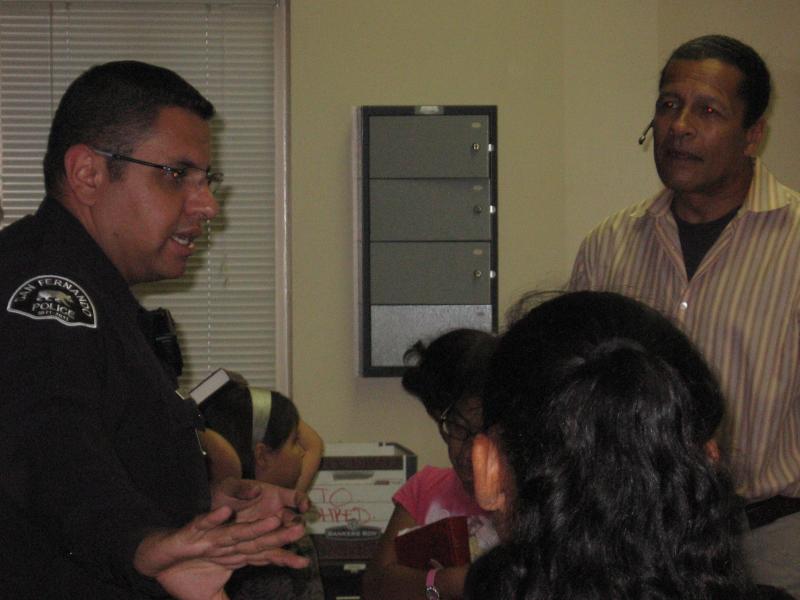 Rev. Eddie and Officer Cervantez sharing with the children.